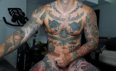 Heavily Tattooed Guy Cums on His Thigh