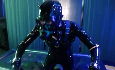 Rubberboy with gas mask pisses and cums